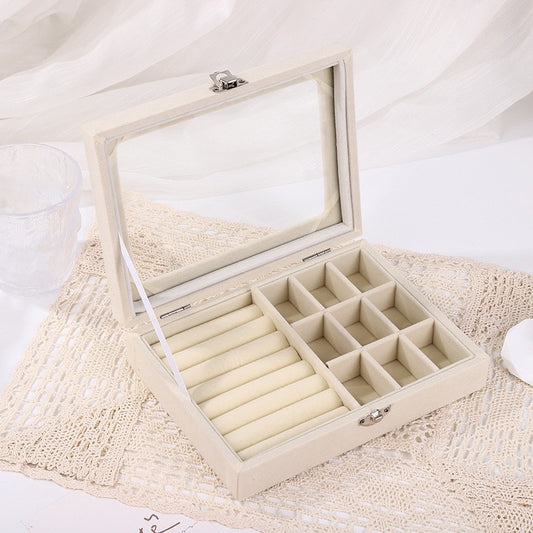 Jewellery holder within multiple compartments