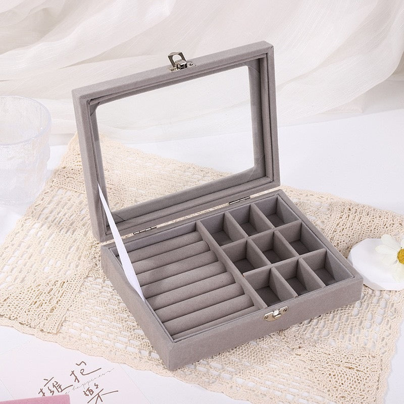 Jewellery holder within multiple compartments